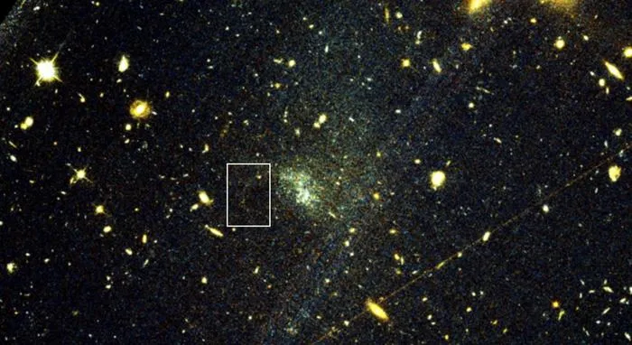 Hubble Space Telescope image showing a faint globular cluster stellar stream extending across a distant galaxy
