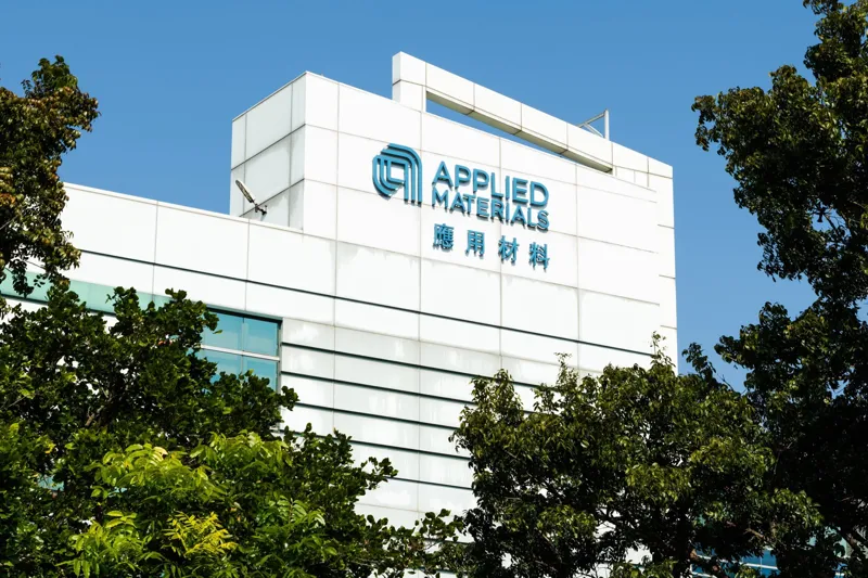 Applied Materials corporate logo displayed at company facility background