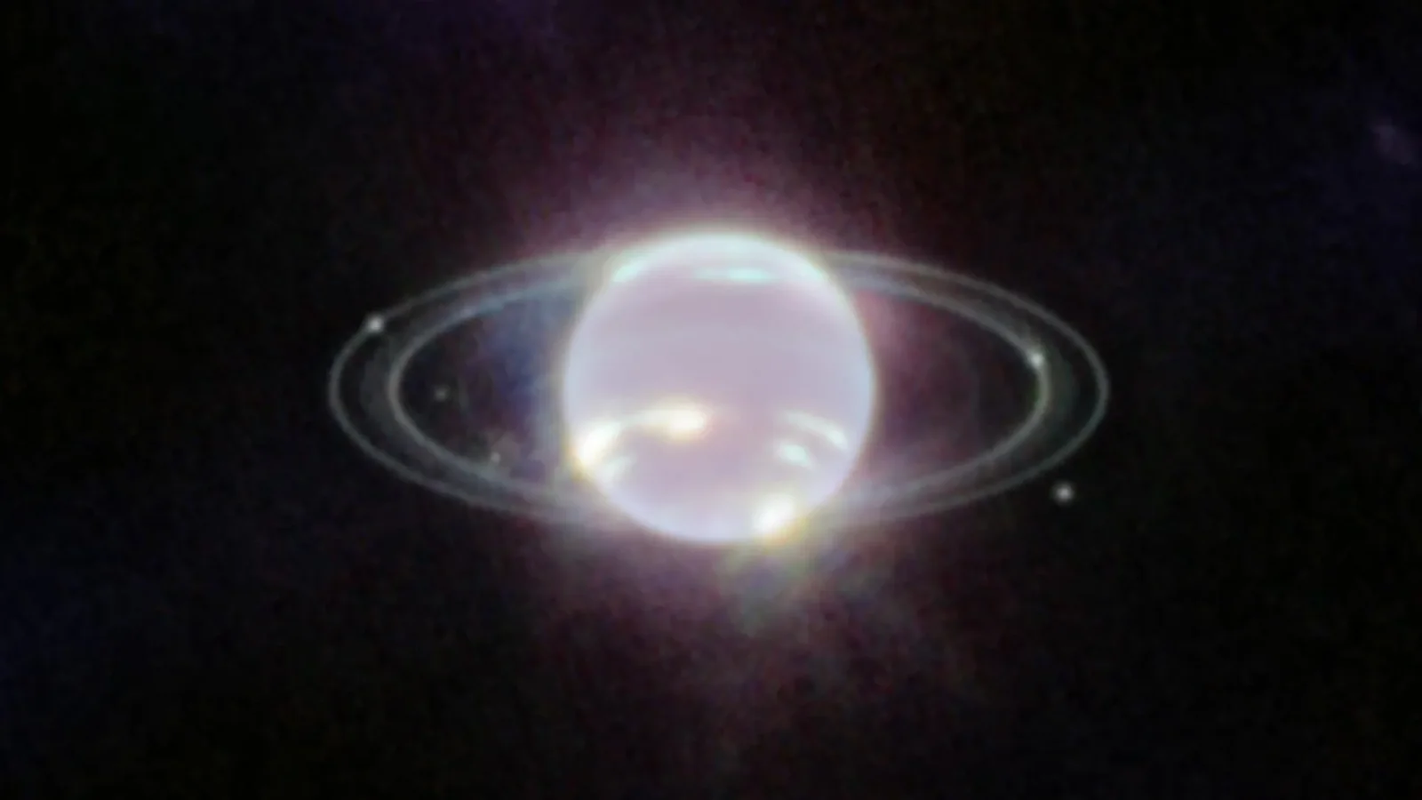 NASA James Webb Space Telescope near-infrared image of Neptune showing its faint rings and inner moons