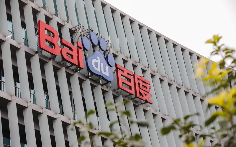 Baidu headquarters building and logo sign representing Chinese technology and artificial intelligence financial results.