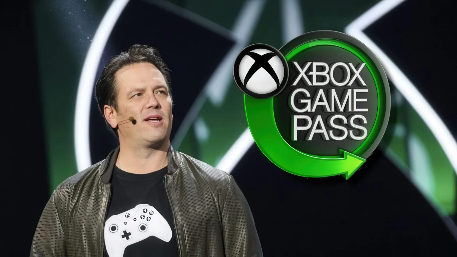 Колишній очільник Xbox Філ Спенсер на тлі логотипа Game Pass