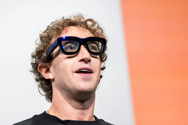 Meta CEO Mark Zuckerberg showcasing augmented reality glasses during a tech keynote presentation