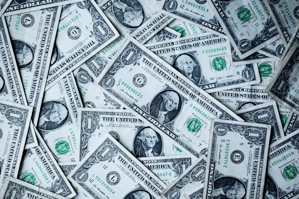 A stack of currency and financial growth indicators representing central bank monetary policy
