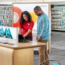 A Target store team member helping a customer in the store retail section