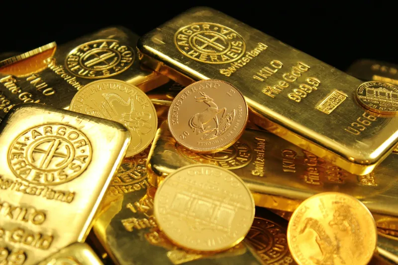 Gold bars stacked in a bank vault representing central bank reserves and market investment